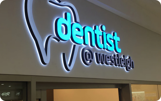 acrylic storefront sign outside dental clinic